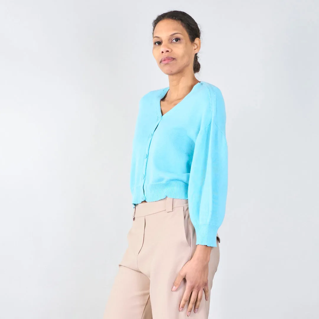 V-neck cardigan with ribbed hem wholesale